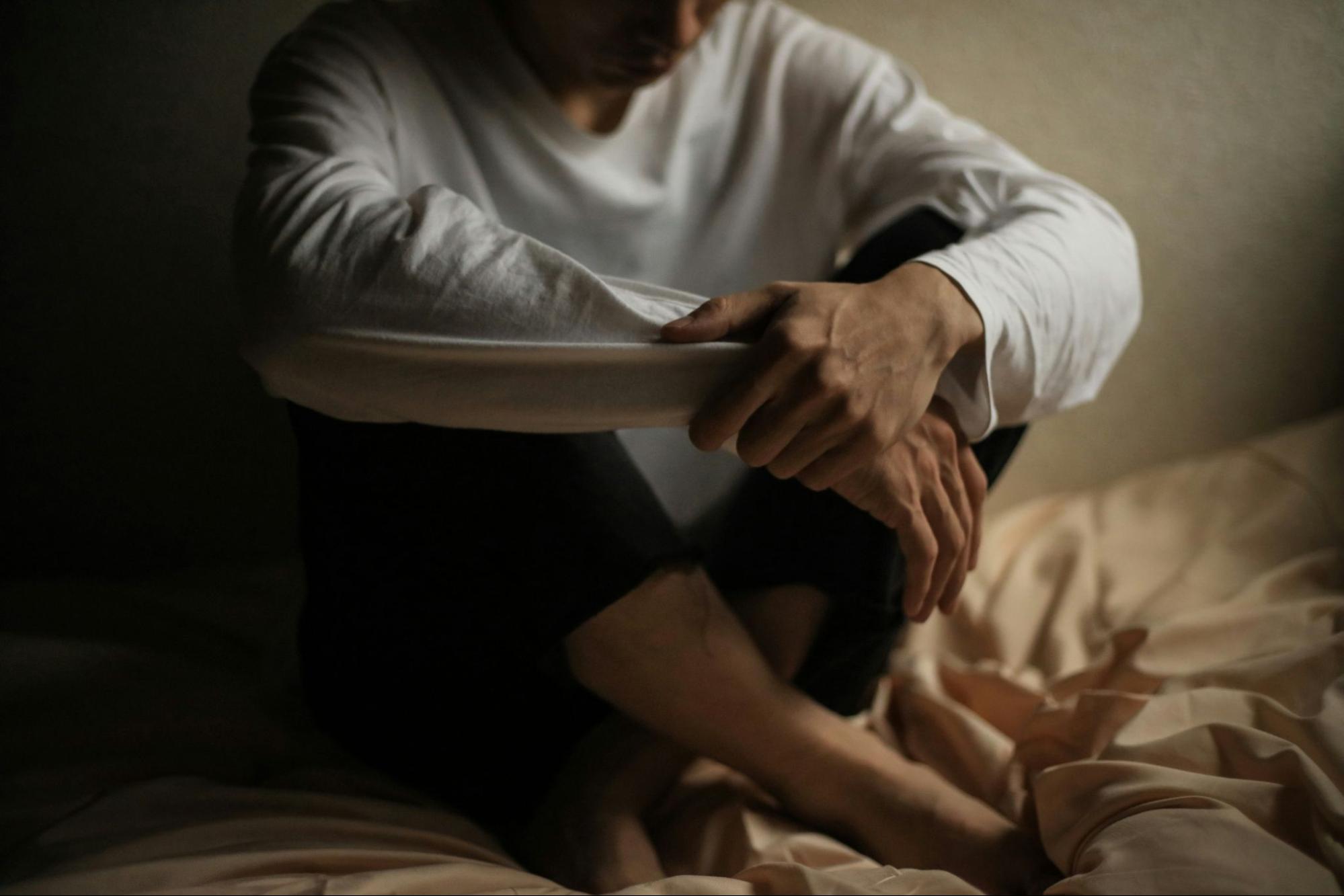 A person experiencing complex PTSD triggers, highlighting the need for trauma recovery coaching and effective strategies for processing trauma.